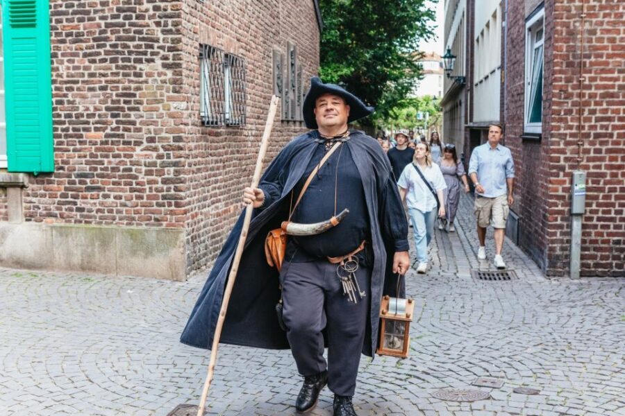 Düsseldorf: Guided Tour with a Night Watchman - Burgplatz and Schlossturm: connecting the old city’s layout to the story